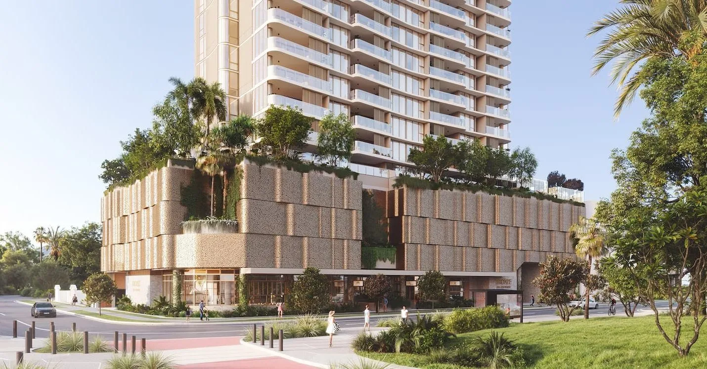 Street-level render of Bronze on Chevron, a perforated bronze podium wrapped in greenery beneath the tower on Chevron Island