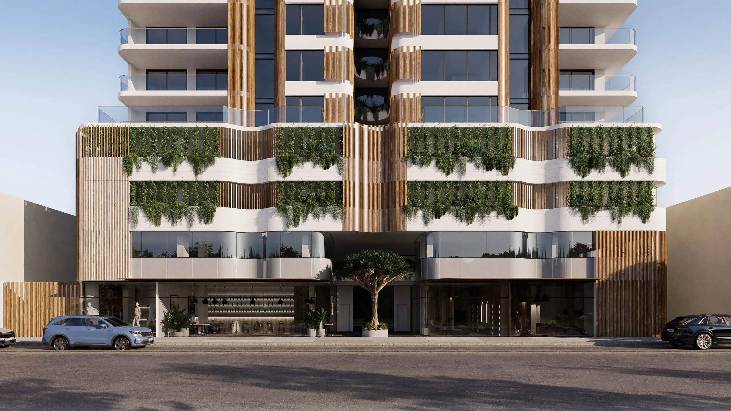 Render of the COMO Varsity Lakes street frontage, curved white balconies with cascading planting above a glazed ground-floor lobby
