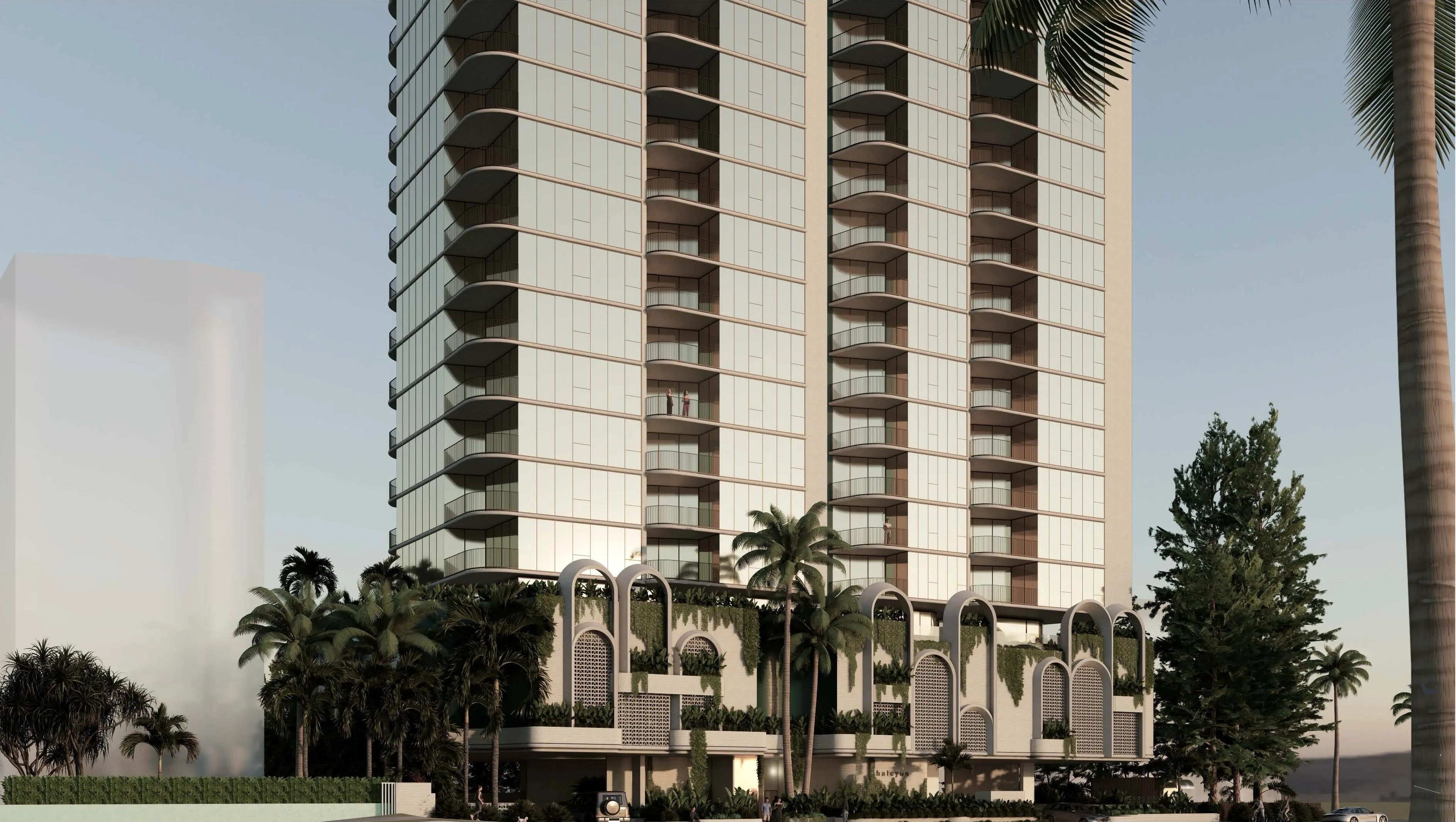 Render of the Halcyon tower at dusk, arched podium screens and palms below 29 levels of curved glass in Surfers Paradise