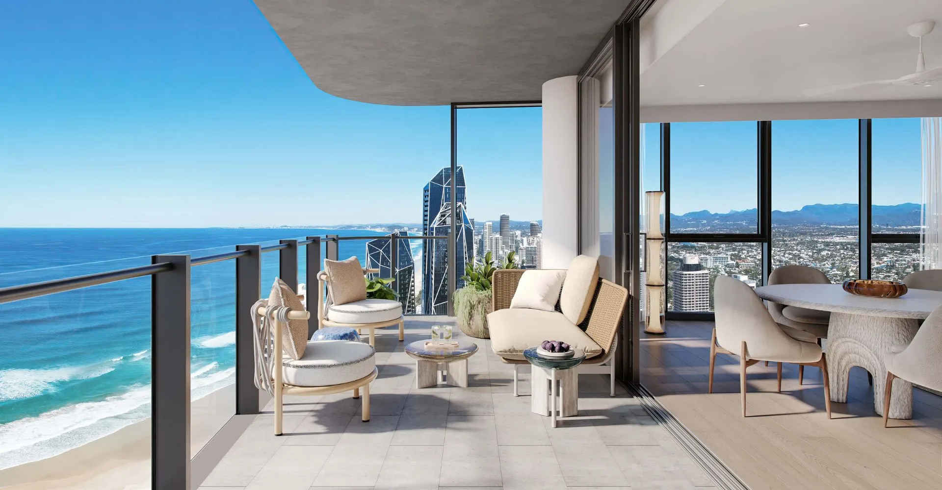 Render of a Palmera corner residence balcony with lounge seating, looking down the Surfers Paradise beachfront to the towers of the skyline