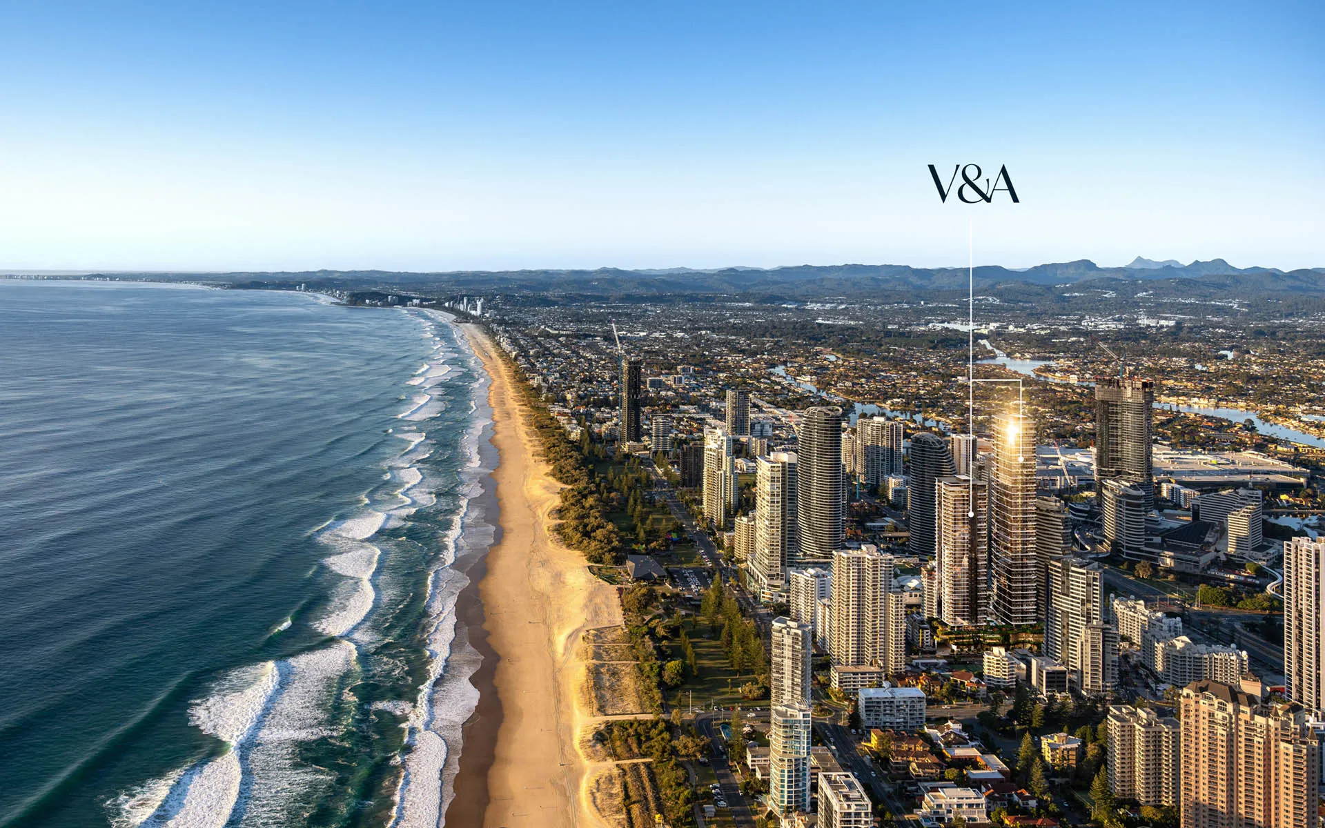 Aerial render of Broadbeach at dawn with the Victoria & Albert twin towers marked rising above Surf Parade, the beach curving away below
